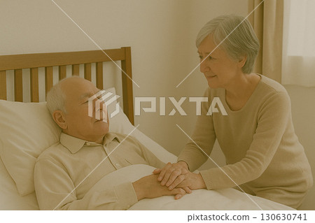 Family members and elderly caregivers staying close together in a hospital room 130630741