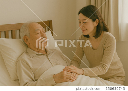 Family members and elderly caregivers staying close together in a hospital room 130630743