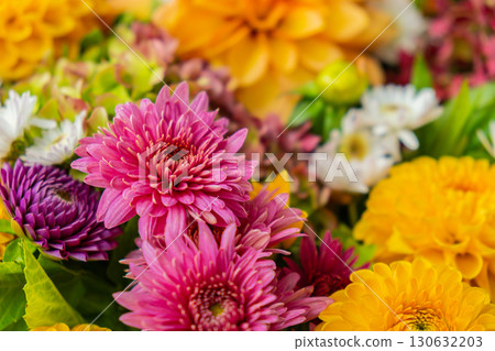 Autumn Fall Bouquet for Thanksgiving holiday. Seasonal Warm colorful blossom flowers arrangement festive decoration. Selective Autumn Fall Bouquet for Thanksgiving holiday. Seasonal Warm colorful blossom flowers arrangement festive decoration. Selective 130632203