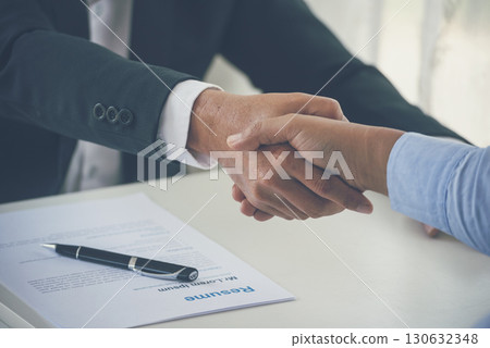 Close up hands Team Business Partners shaking hands together to Greeting Start up new project. Shakehand Teamwork Partnership office desk. Businessman partners handshake together. Business concept Close up hands Team Business Partners shaking hands together to Greeting Start up new project. Shakehand Teamwork Partnership office desk. Businessman partners handshake together. Business concept 130632348