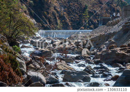 Langtang Khola hydroelectric small dam in Langtang national park, Nepal. The purpose of producing hydroelectric power, dams are created to control river flow and regulate flooding. 130633110