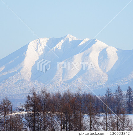Mount Oputateshike in the Tokachi mountain range seen from the hills of Biei, Hokkaido in winter Mount Oputateshike in the Tokachi mountain range seen from the hills of Biei, Hokkaido in winter 130633842