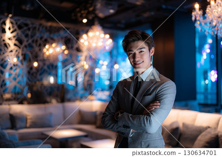 Confident male sommelier with his arms crossed in a luxury restaurant 130634701