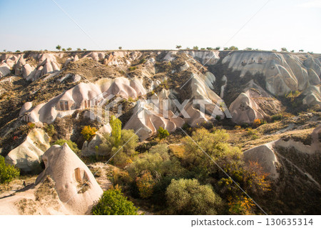Valley of doves panoramic view near Uchisar castle in sunrise, Cappadocia Valley of doves panoramic view near Uchisar castle in sunrise, Cappadocia 130635314