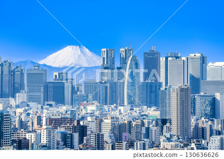 Mount Fuji towering over the cityscape 130636626
