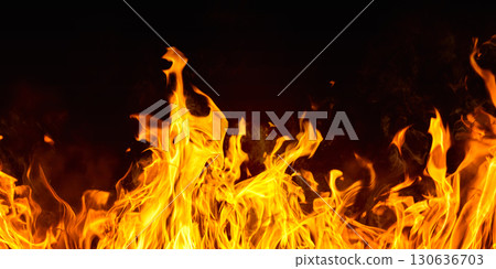 Dramatic red, orange, yellow flame and smoke rising against a dark background. Realistic, abstract fire burning background texture overlay. Vivid and hot hell or blazing fire wallpaper Dramatic red, orange, yellow flame and smoke rising against a dark background. Realistic, abstract fire burning background texture overlay. Vivid and hot hell or blazing fire wallpaper 130636703