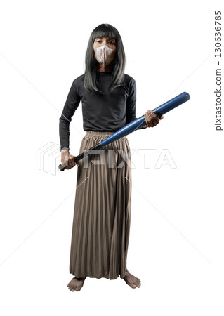 Indonesian southeast asian transgender man dressed as a woman wearing a bloody face mask and holding a baseball bat isolated over a white background. Concept of Halloween, Sister Hong, or red uncle 130636785