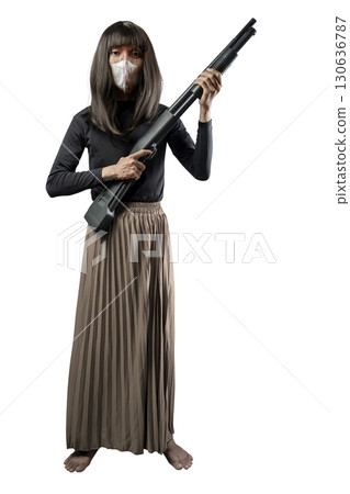 Indonesian southeast asian transgender man dressed as a woman wearing a bloody face mask and holding a shotgun isolated over a white background. Concept of Halloween, Sister Hong, or red uncle 130636787
