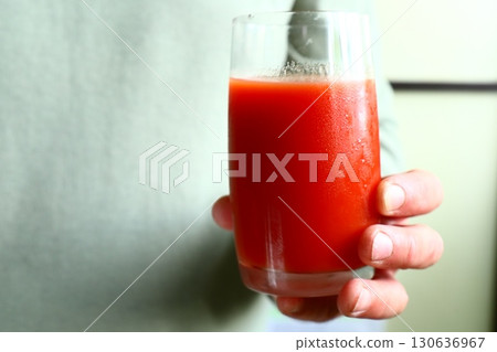 Glass of fresh tomato juice 130636967