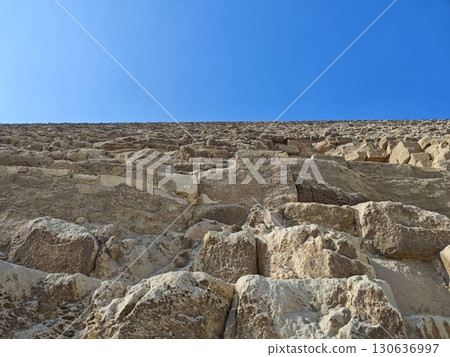 A close-up of the stepped slopes of the Pyramid of Khufu in the Giza Desert in Egypt. 130636997