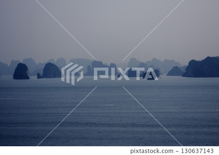 The strange rock formations of Halong Bay, shrouded in mist, look like ink paintings The strange rock formations of Halong Bay, shrouded in mist, look like ink paintings 130637143