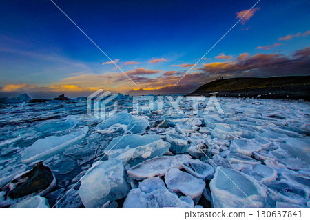 The contrast between the ice field and the evening sky 130637841