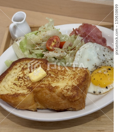 A delightful brunch spread featuring a mix of savory and sweet bites. perfectly toasted bread, fresh fruits, soft scrambled eggs, and a refreshing drink to brighten your late morning. A delightful brunch spread featuring a mix of savory and sweet bites. perfectly toasted bread, fresh fruits, soft scrambled eggs, and a refreshing drink to brighten your late morning. 130638699