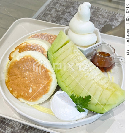 A delightful brunch spread featuring a mix of savory and sweet bites. perfectly toasted bread, fresh fruits, soft scrambled eggs, and a refreshing drink to brighten your late morning. A delightful brunch spread featuring a mix of savory and sweet bites. perfectly toasted bread, fresh fruits, soft scrambled eggs, and a refreshing drink to brighten your late morning. 130638718