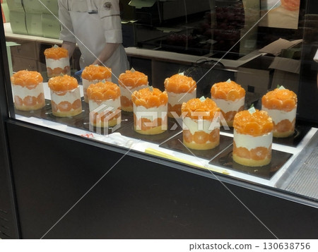 Light and fluffy mango shortcake with soft sponge layers, fresh mango slices, and creamy whipped filling. A perfect blend of tropical sweetness and airy texture for a refreshing dessert. 130638756