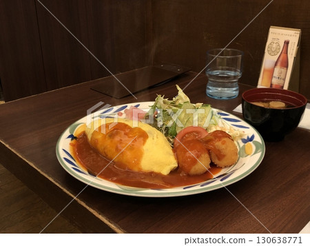 Omurice is an example of yoshoku consisting of an omelette made with fried rice and usually topped with ketchup or demi glace sauce. Omurice is an example of yoshoku consisting of an omelette made with fried rice and usually topped with ketchup or demi glace sauce. 130638771
