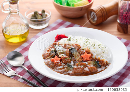 Home-style curry rice using mackerel jerky, garnished with star-shaped carrots and fukujinzuke pickles, a Japanese-Western fusion recipe 130638983