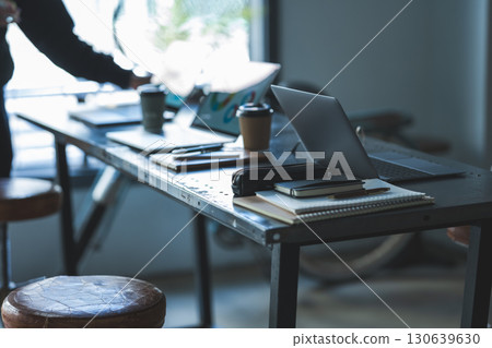Cluttered desk 130639630
