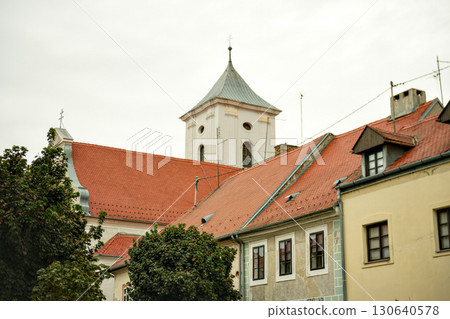 Church tower and rooftops in Osijek Croatia on cloudy day Church tower and rooftops in Osijek Croatia on cloudy day 130640578