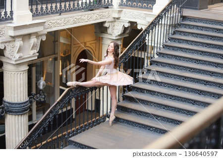 Ballet dancer in tutu posing on historic staircase Ballet dancer in tutu posing on historic staircase 130640597