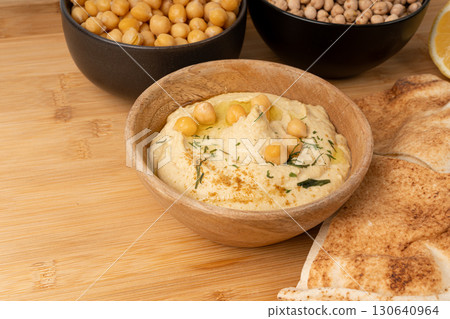 Hummus in bowl, houmous dip, chickpea humus tahini sauce, middle eastern spread 130640964