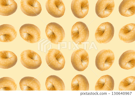 Bagel Pattern on Yellow Background, Round Bread Bun Minimal Wallpaper with Copy Space 130640967