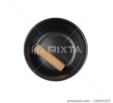 Rawhide chew stick for dogs isolated, half-eaten oral care hygiene dog food, pressed collagen 130641037