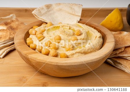 Hummus in bowl, houmous dip, chickpea humus tahini sauce, middle eastern spread 130641188