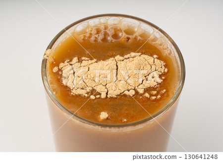 Maca powder drink isolated, dry Peruvian ginseng beverage, powder in water, ground ayak willku tea Maca powder drink isolated, dry Peruvian ginseng beverage, powder in water, ground ayak willku tea 130641248