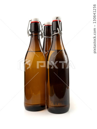 Old beer bottle, brown glass vintage beerbottle isolated, a quality traditional time-tested drink 130641256