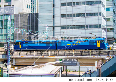 Yokohama cityscape, Japan JR Freight EH200 series electric locomotive ECO-POWER Blue Thunder passing Sakuragicho Station 130641932