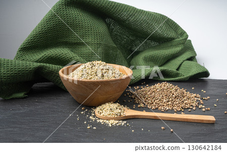 Shelled hemp seeds pile, peeled cannabis grains, marijuana kernels without peel 130642184