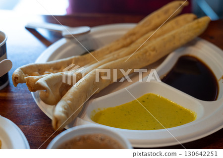 Fafda Indian snack food made from chickpea flour with spices. Faafda crispy sticks or fafda 130642251