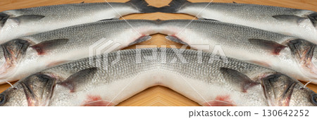 Fish scales texture background, sea bass skin close up, macro shot of silver labrax scale Fish scales texture background, sea bass skin close up, macro shot of silver labrax scale 130642252