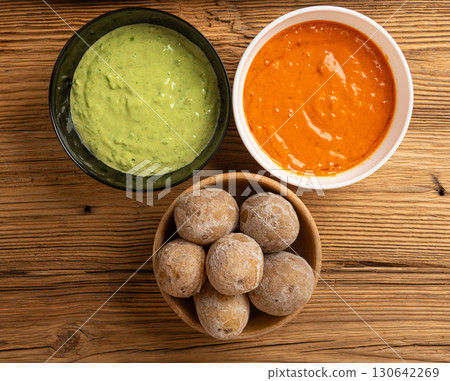 Red mojo rojo and green mojo verde sauces, traditional Tenerife dips, mojo picon dressing Red mojo rojo and green mojo verde sauces, traditional Tenerife dips, mojo picon dressing 130642269