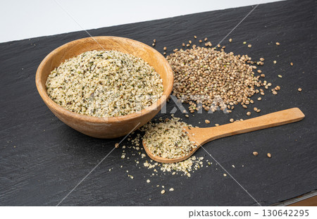 Shelled hemp seeds pile, peeled cannabis grains, marijuana kernels without peel Shelled hemp seeds pile, peeled cannabis grains, marijuana kernels without peel 130642295