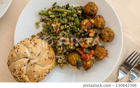 Vegan meatball, round cutlet dinner on white plate. Fried vegetable balls, falafel 130642306