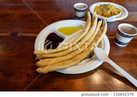 Fafda Indian snack food made from chickpea flour with spices. Faafda crispy sticks or fafda 130642376