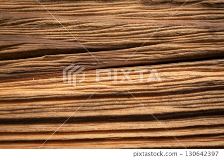 Old wood textured background. Dark driftwood surface, burnt wood brushing, macro brown floor Old wood textured background. Dark driftwood surface, burnt wood brushing, macro brown floor 130642397