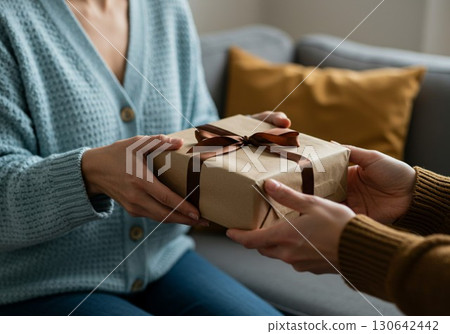 The moment of giving a present: A heartwarming scene of gift exchange 130642442