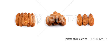 Almonds pile isolated, nut group, almond seeds, brown scattered fruit kernels on white background Almonds pile isolated, nut group, almond seeds, brown scattered fruit kernels on white background 130642493