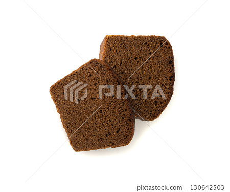 Black rye bread isolated, dark brown sliced loaf, sourdough borodinsky rugbrod square slices 130642503