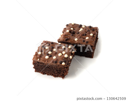 Chocolate brownie cake sprinkled with white and dark balls, classic birthday brownie square piece 130642509