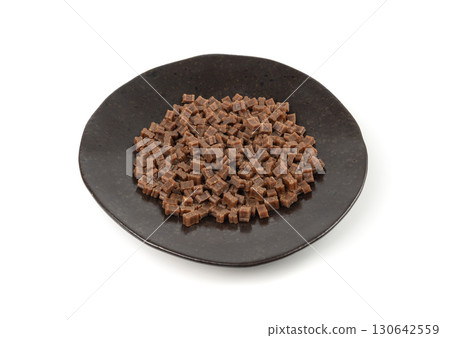 Mini bone-shaped pet food, small dogs crunchy treats, flavored brown dry kibble, canine food 130642559