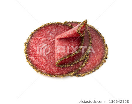 Pepper salami cuts isolated, thin sausage slices. Sliced dry chorizo, sausages round pieces Pepper salami cuts isolated, thin sausage slices. Sliced dry chorizo, sausages round pieces 130642568