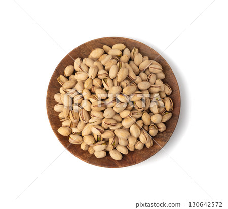 Fried salt pistachio nuts isolated. Baked pistachios pile, roasted green pistache fruit in shell on white 130642572