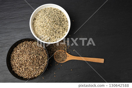 Shelled hemp seeds pile, peeled cannabis grains, marijuana kernels without peel Shelled hemp seeds pile, peeled cannabis grains, marijuana kernels without peel 130642588