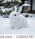 Posing with a cute snow rabbit 130642787