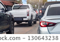 Rear side ov silver car with turn on brake light. Many car queue is full of traffic jams in the city. 130643238