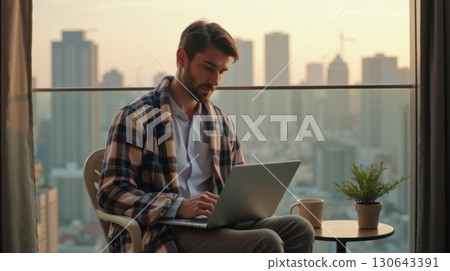 young man with a laptop 130643391